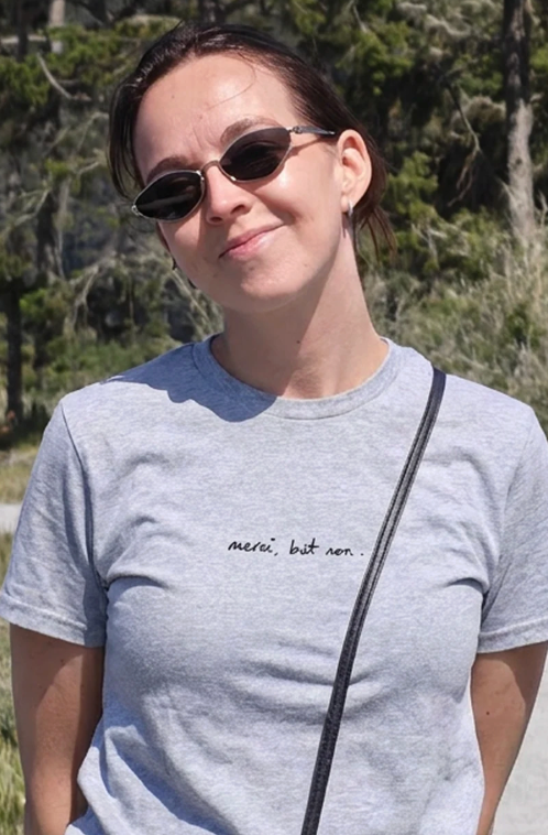 "merci, but non" signature unisex t-shirt - light