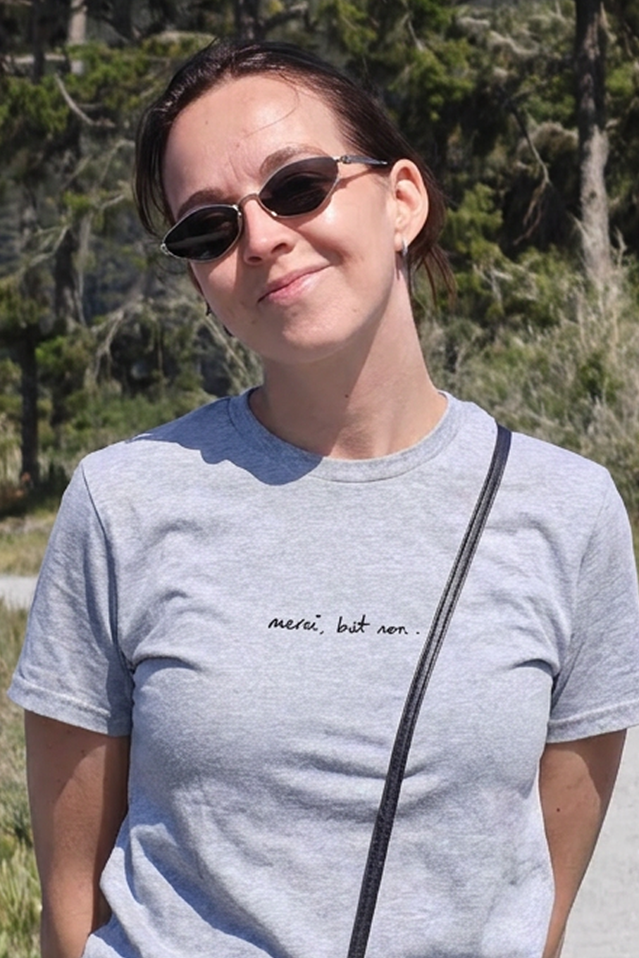 "merci, but non" unisex t-shirt - light